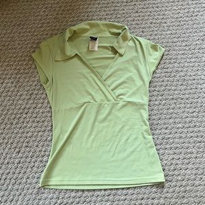 Super cute light green wrap top, washed but never worn. Like new